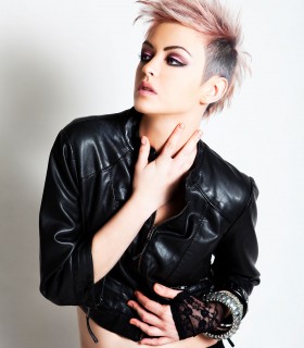 Punk style PU leather jacket with an asymmetrical zip front